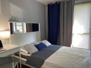 Posteľ alebo postele v izbe v ubytovaní Apartament AMSTERDAM