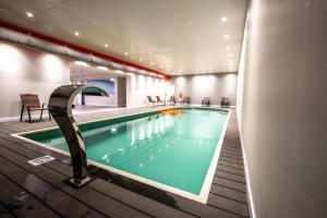 a pool in a hotel room with a swimming pool at Cilene del Fuego Suites & Spa in Ushuaia