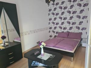 Posteľ alebo postele v izbe v ubytovaní Robertó Apartman