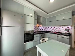 A kitchen or kitchenette at X SUITE APART