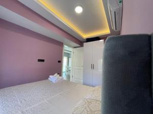 A bed or beds in a room at X SUITE APART