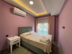 A bed or beds in a room at X SUITE APART