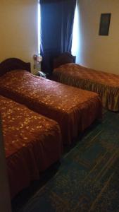 Cama ou camas em um quarto em Hotel Internacional