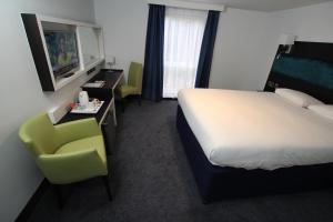 Postel nebo postele na pokoji v ubytování Ramada Oxford