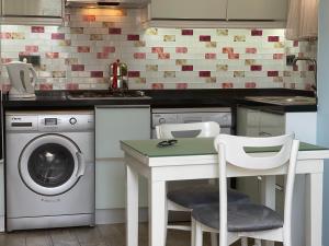 A kitchen or kitchenette at X SUITE APART