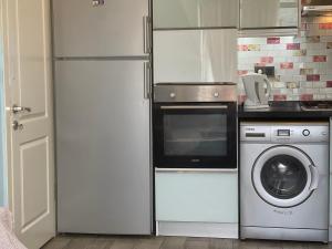 A kitchen or kitchenette at X SUITE APART