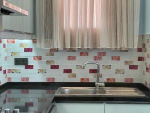 A kitchen or kitchenette at X SUITE APART