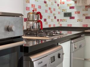 A kitchen or kitchenette at X SUITE APART