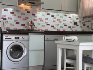 A kitchen or kitchenette at X SUITE APART
