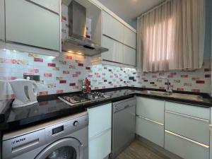A kitchen or kitchenette at X SUITE APART