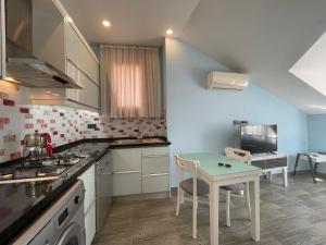 A kitchen or kitchenette at X SUITE APART