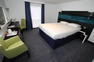 Postel nebo postele na pokoji v ubytování Ramada Oxford