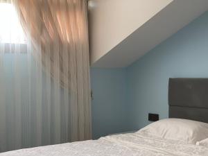 A bed or beds in a room at X SUITE APART