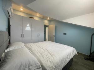 A bed or beds in a room at X SUITE APART