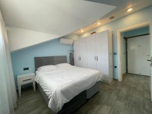 A bed or beds in a room at X SUITE APART
