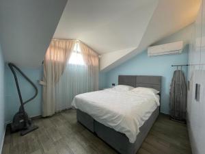 A bed or beds in a room at X SUITE APART Még 37 kép