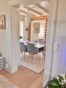 a dining room with a table and chairs at Lofoten Villa in Reine