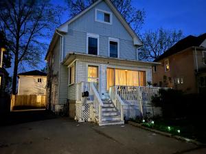 a house with a staircase leading to the front door at Cheerful residence in Niagara Falls