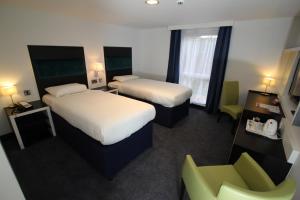 Postel nebo postele na pokoji v ubytování Ramada Oxford