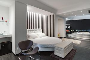 Postel nebo postele na pokoji v ubytování Modica Palace Hotel