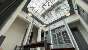 a house with a skylight and a glass ceiling at REPUBLICANA CASA HOSTAL - HABITACION 5 TAIRONA in Bogotá +2 photos