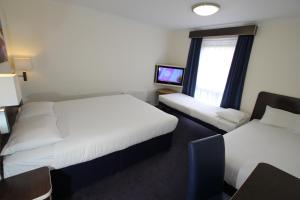 Postel nebo postele na pokoji v ubytování Ramada Oxford