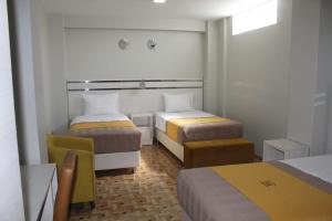 Postel nebo postele na pokoji v ubytování Mercé Hotel