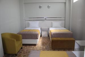 Postel nebo postele na pokoji v ubytování Mercé Hotel