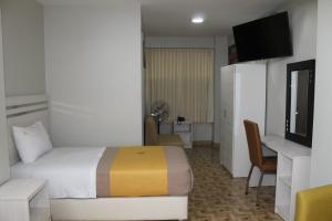 Postel nebo postele na pokoji v ubytování Mercé Hotel