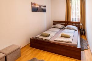 Posteľ alebo postele v izbe v ubytovaní ELITE CENTER APARTMAN
