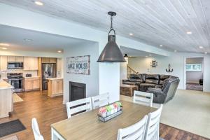 a kitchen and living room with a table and a couch at Cascade Lakefront Home Boat Dock, Fire Pit! in Cascade