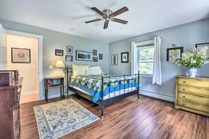 a bedroom with a bed and a ceiling fan at Sunny Morristown Home - Walk to Restaurants! in Morristown