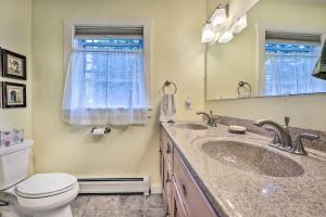 a bathroom with two sinks and a toilet and a mirror at Sunny Morristown Home - Walk to Restaurants! in Morristown +18 photos