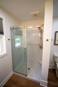 a shower with a glass door in a bathroom at Mission Springs Resort in Ashland