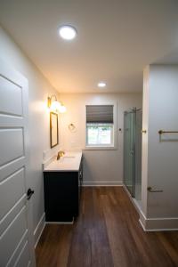 a bathroom with a sink and a shower at Mission Springs Resort in Ashland