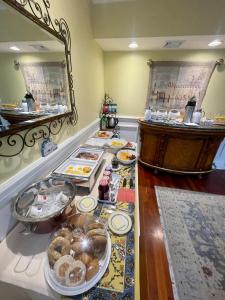 a buffet with many plates of food on a table at Atlantis Inn Hotel in Ocean City