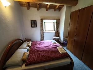 Rúm í herbergi á Albergo Ristorante Selva