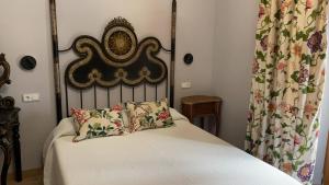 Postel nebo postele na pokoji v ubytování Hotel-Hospedería los Templarios