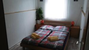 מיטה או מיטות בחדר ב-Nice apartment 3 Harz