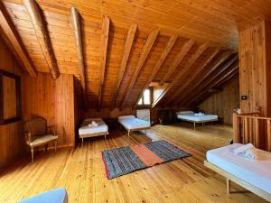 a large room with wooden walls and wooden floors at Prades Cal Rueda in Prades