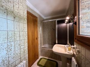 a bathroom with a sink and a bath tub at Prades Cal Rueda in Prades +36 photos