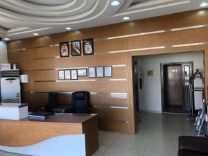 a waiting area in a hospital with wooden walls at شقق ليالي الشرق للوحدات 2 in Al Mubarraz