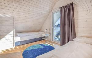 Ένα ή περισσότερα κρεβάτια σε δωμάτιο στο Nice Home In Sianozety With Kitchen
