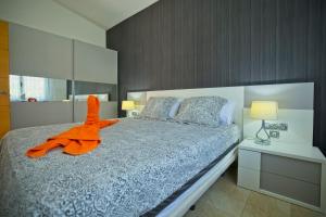 Posteľ alebo postele v izbe v ubytovaní BlUE LAGOON