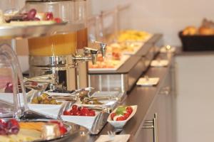 a buffet line with many plates of food at Hotel am Markt in Cochem
