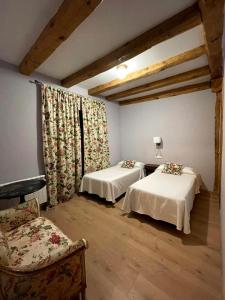Postel nebo postele na pokoji v ubytování Hotel-Hospedería los Templarios