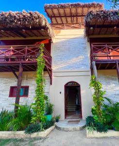 a house with a staircase in front of it at Residencial Bem-te-vi in Jericoacoara