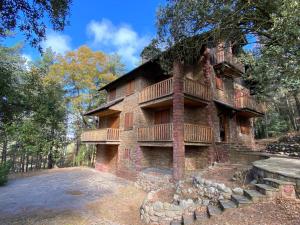 a large brick building with balconies on it at Prades Cal Rueda in Prades
