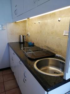 Η κουζίνα ή μικρή κουζίνα στο Strand Beach Road Unit 416