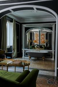 a living room filled with furniture and a window at Casa Howard Firenze - Residenza d'Epoca in Florence